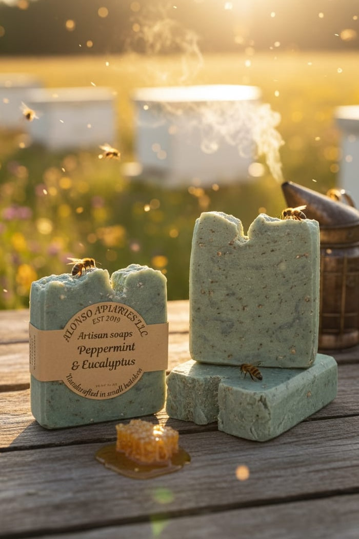 Two bars of peppermint and eucalyptus soap on a wooden surface with a natural background.